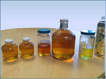 Various glass containers with liquids inside