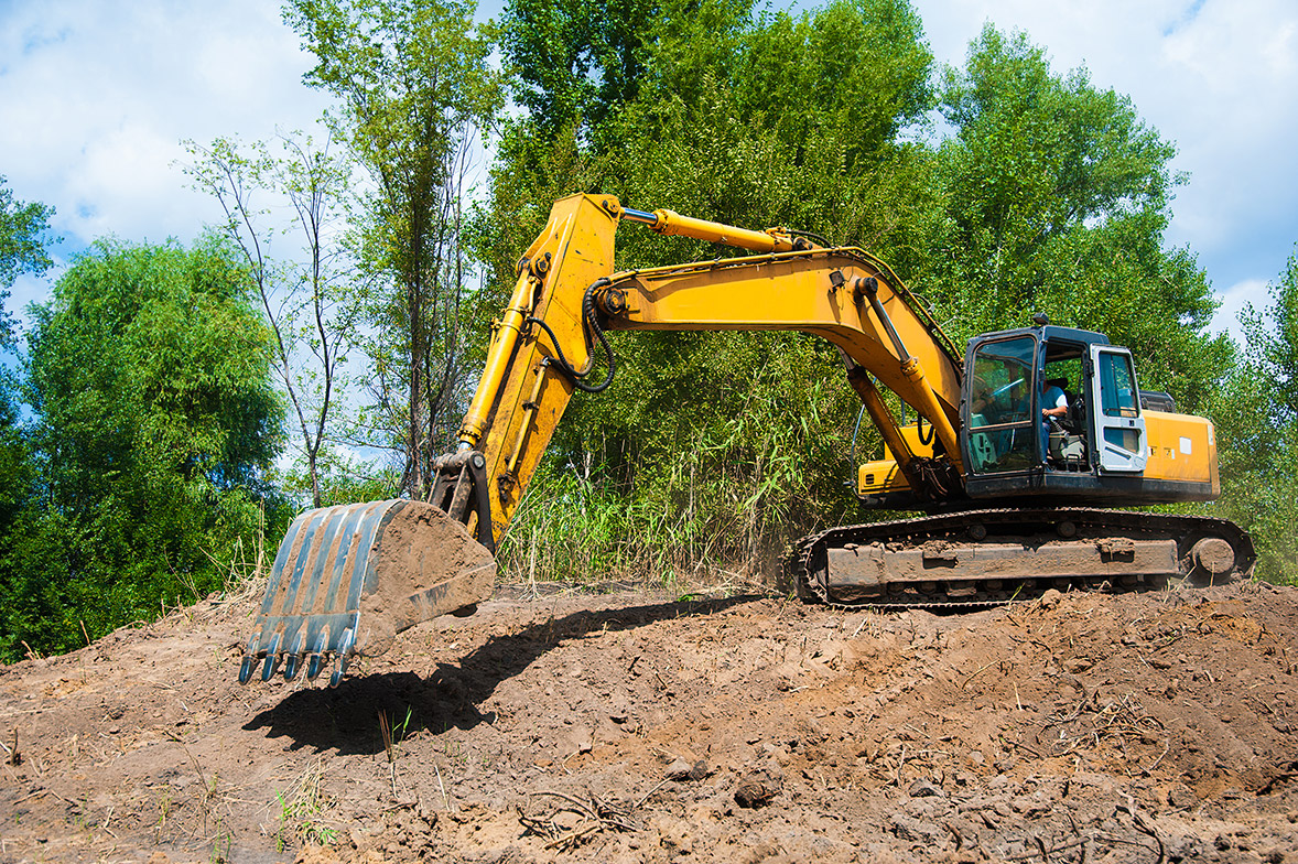 Man operating tractor