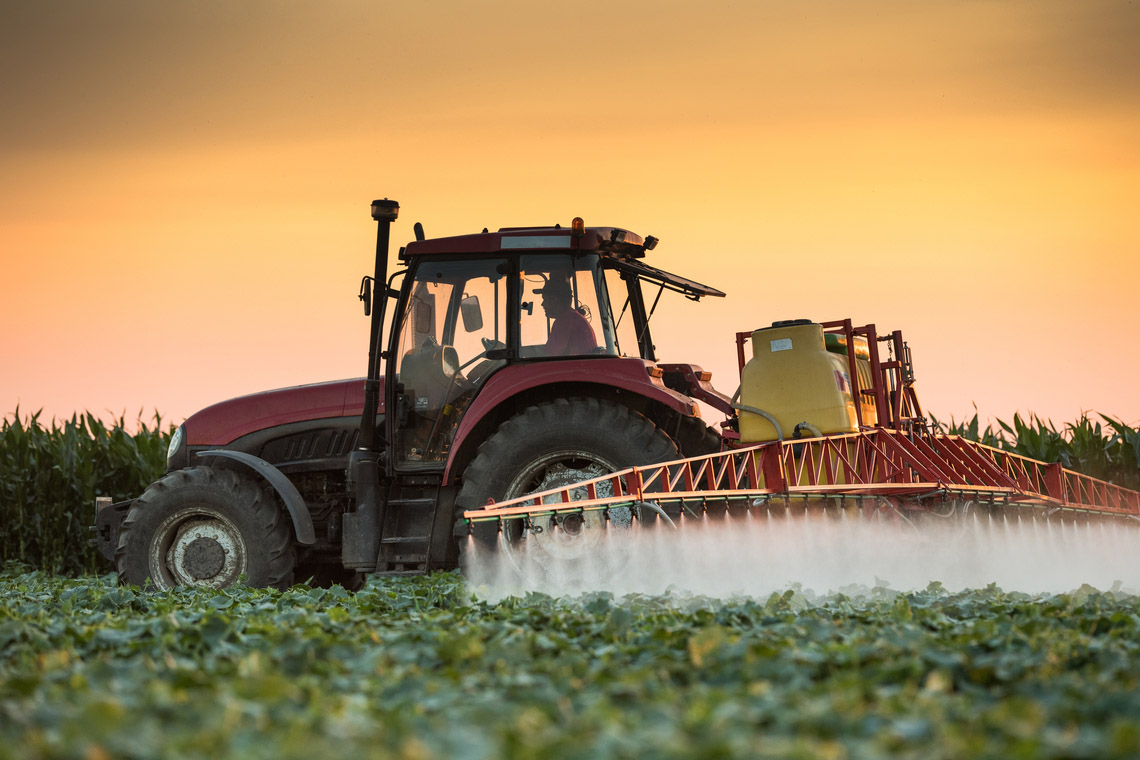 Tractor spraying fruits and vegetables