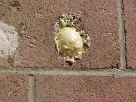 Stucco material patching a hole in the wall